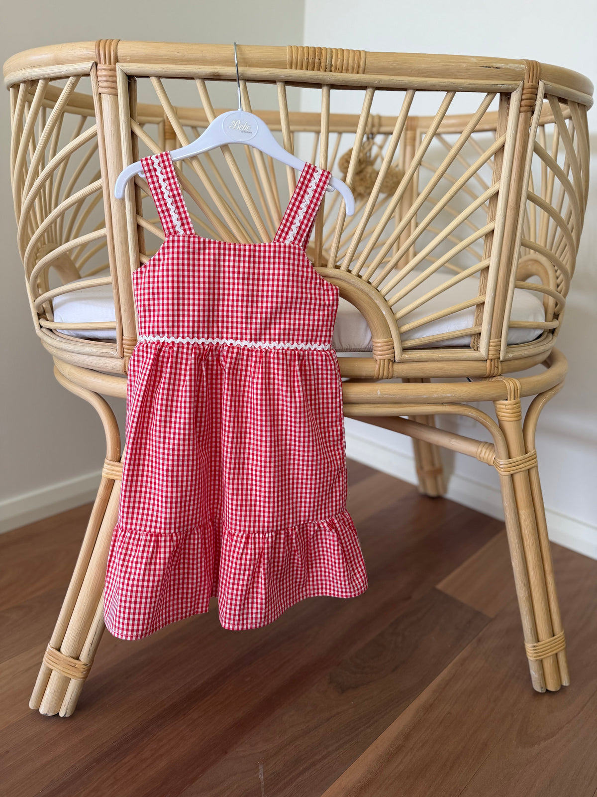 A red and white gingham kids dress with a ruffled hem, red check matching girls dress Christmas girls dress at Tajoh and gg